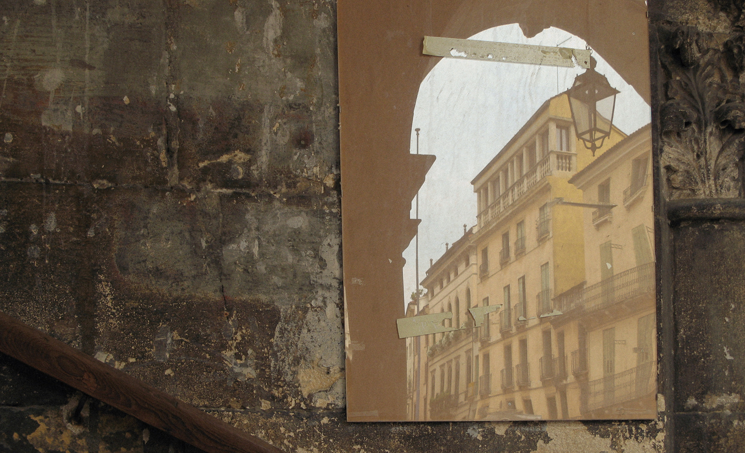 reflection of Italian city on a stone wall